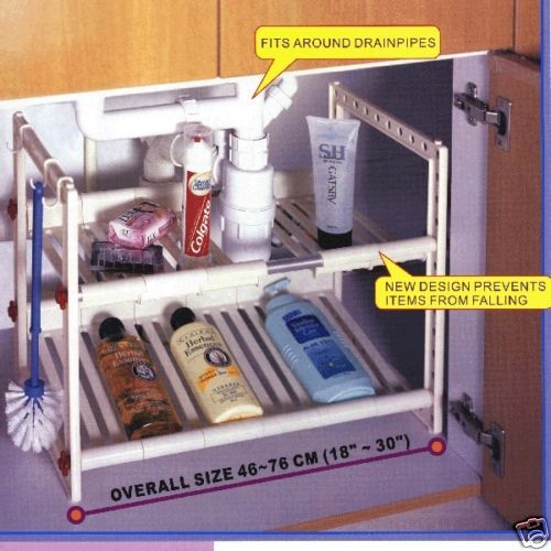 Under sink Shelf, storage, goes around drain pipes  